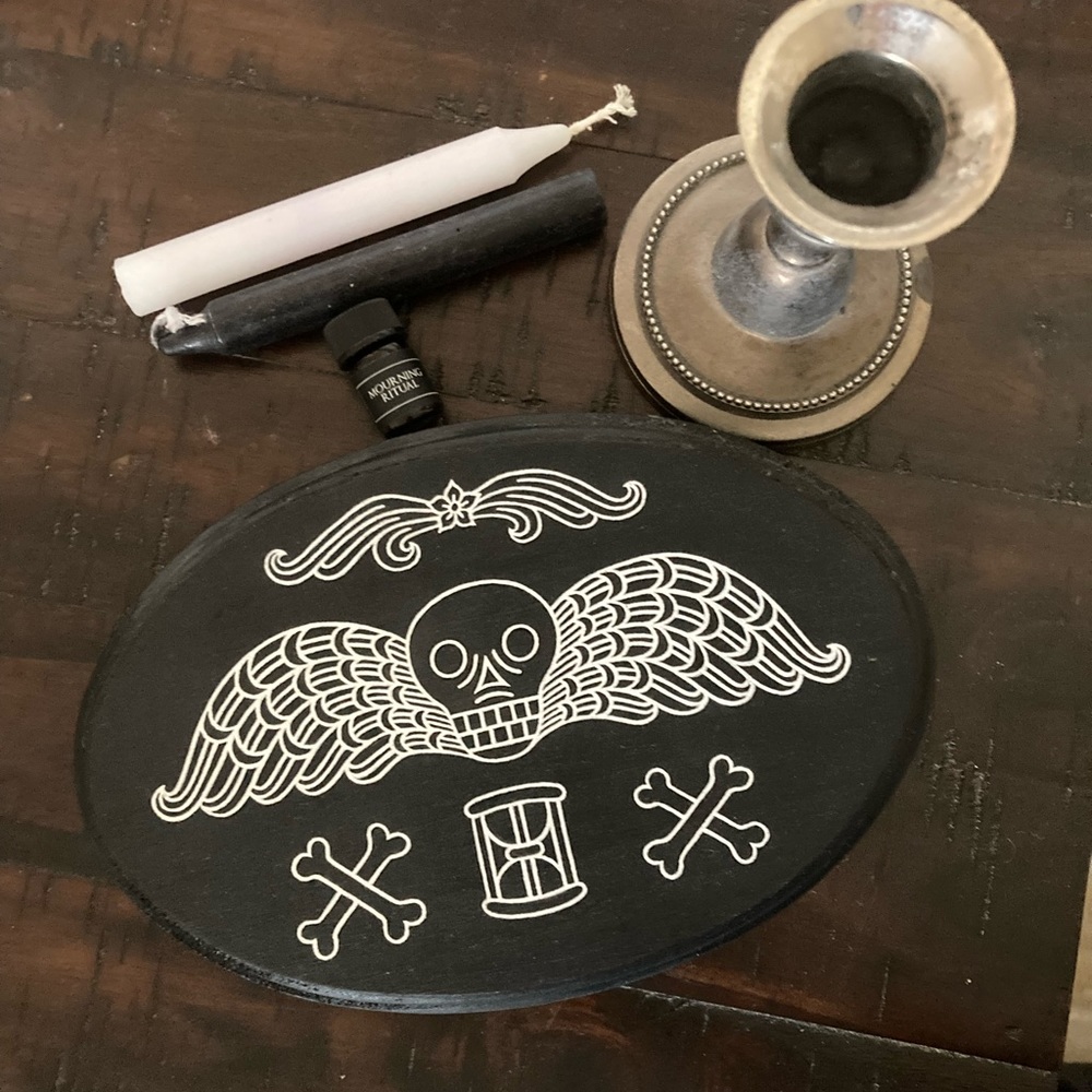 Death Follows wall plaque